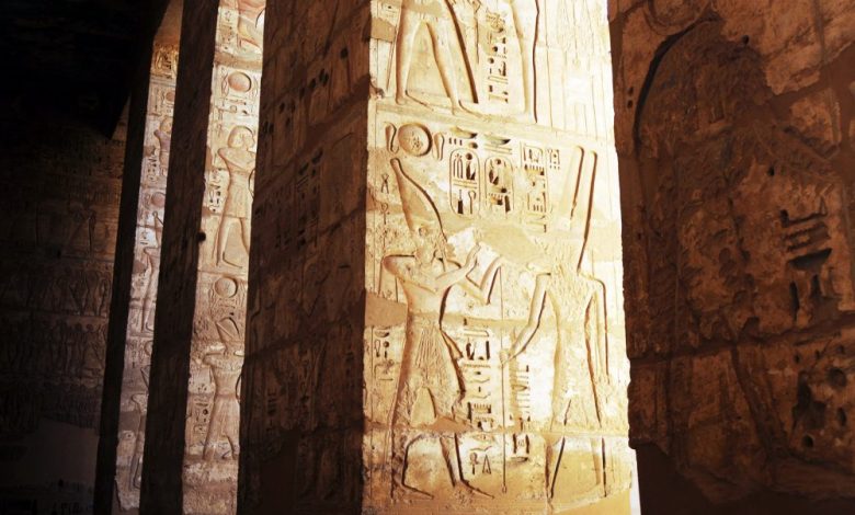 Inscriptions on the walls of an ancient Egyptian Temple. Shutterstock.