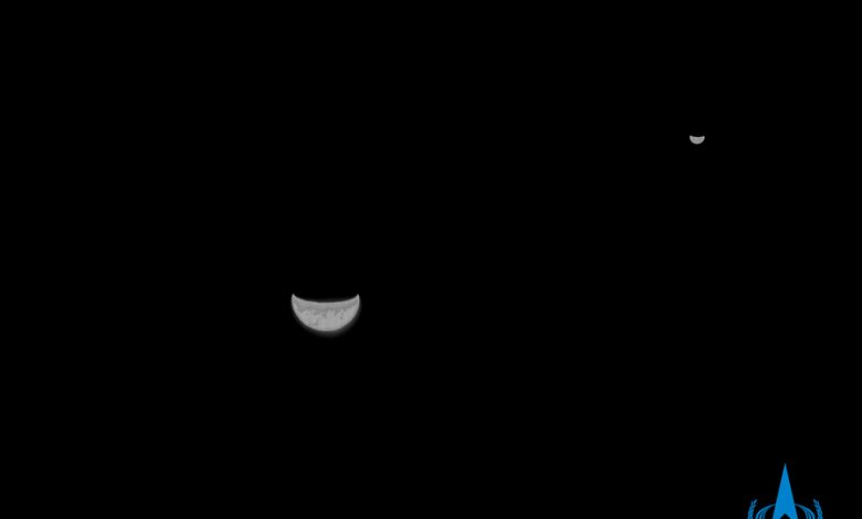 A black and white image showing both the Earth and the Moon. Image Credit: CNSA.