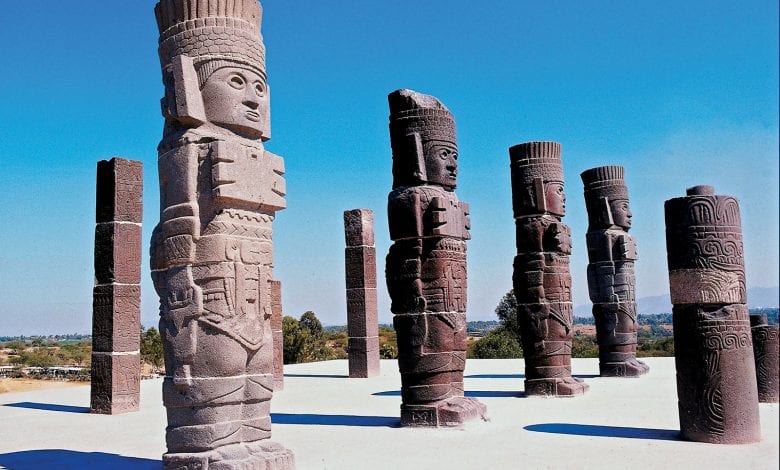 The massive statues of the Toltec Warriors holding the curious Handbags of the Gods. Where else has this motif been found? Credit: Britannica