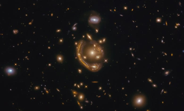 We are fortunate to see yet another one of Hubble's spectacular images of rare cosmic events, this time of the largest Einstein Ring known to science. Credit: ESA/Hubble & NASA, S. Jha; Acknowledgment: L. Shatz