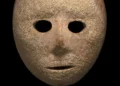 Ancient Stone Mask. Credit: Clara Amit, Israel Antiquities Authority.