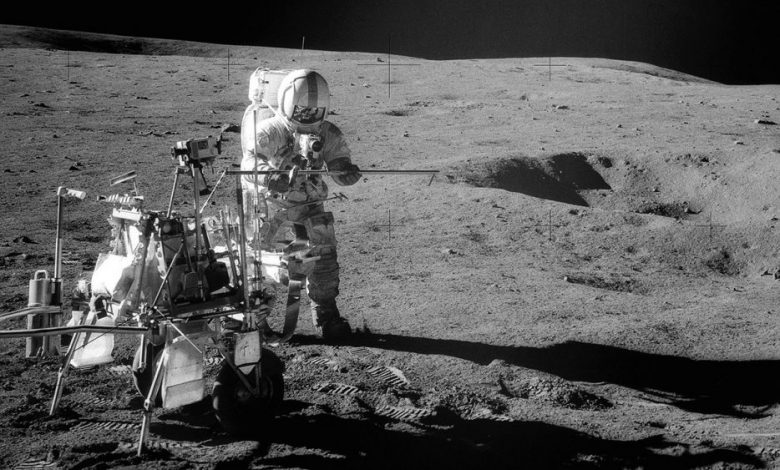 Apollo 14 Astronaut Alan B. Shepard Jr. assembles equipment on the lunar surface in February 1971. Credit: NASA.