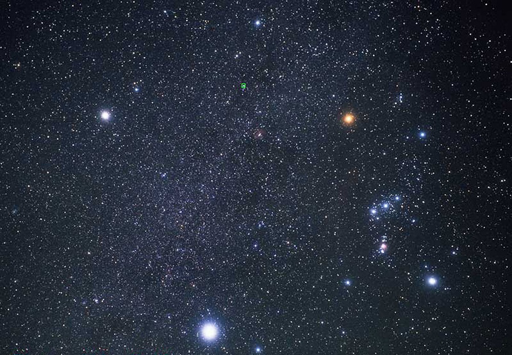 Procyon (top left), Betelgeuse (top right), and Sirius (bottom) form the Winter Triangle. Orion is to the right. Image Credit: Hubble European Space Agency / Akira Fujii.