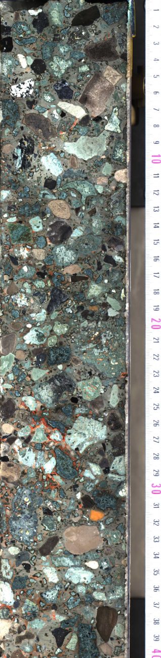 Part of a core section from the Chicxulub impact crater. It is suevite, a type of rock, formed during the impact, that contains rock fragments and melted rocks. IODP, CC BY-ND 4.0.