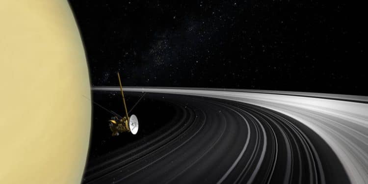 An artist's concept of the Cassini orbiter crossing Saturn's ring plane. New measurements of the rings' mass give scientists the best answer yet to the question of their age. Image Credit: NASA/JPL-Caltech.