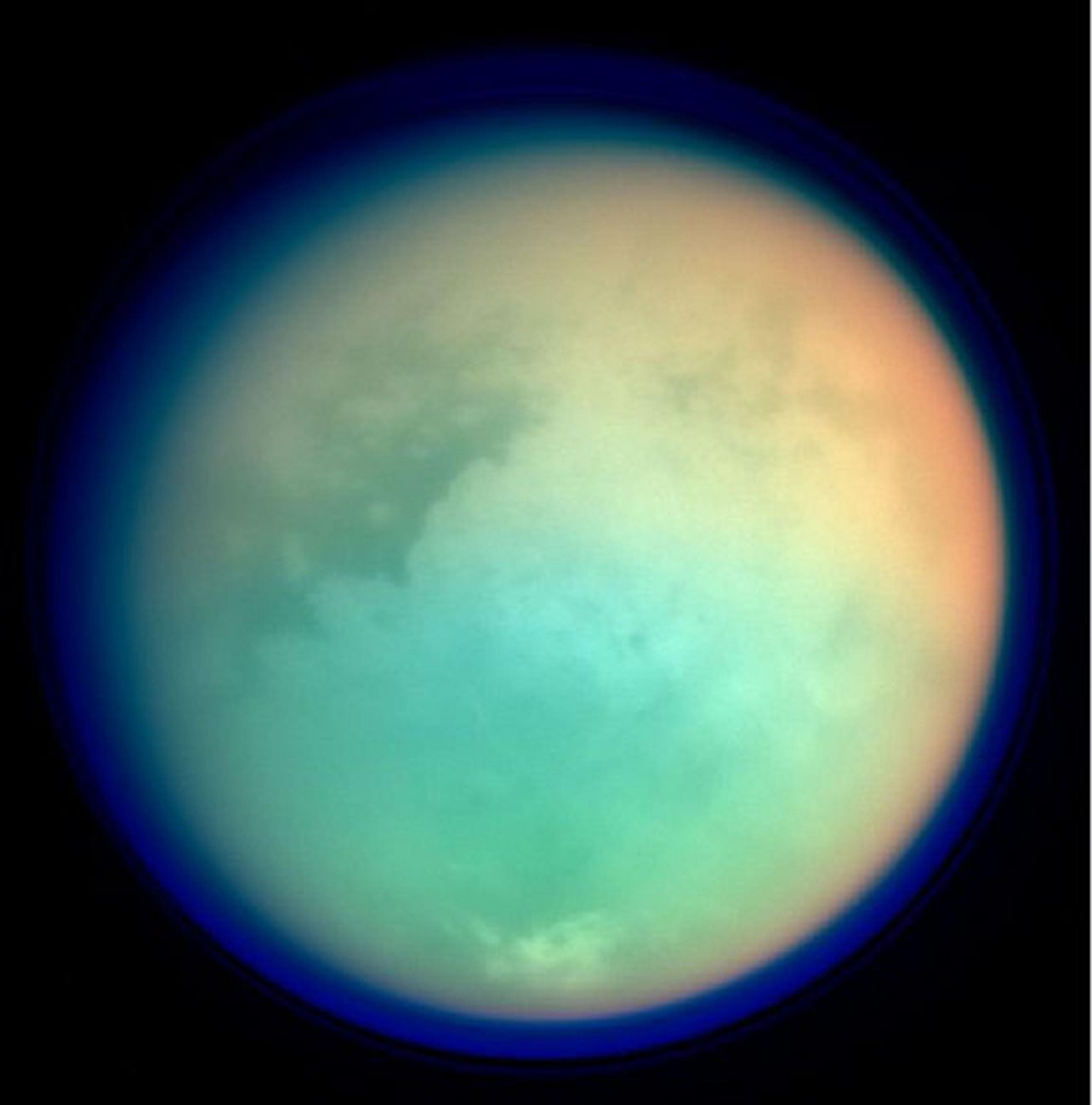 This undated NASA handout shows Saturn's moon, Titan, in ultraviolet and infrared wavelengths. The Cassini spacecraft took the image while on its mission to. gather information on Saturn, its rings, atmosphere and moons. The different colors represent various atmospheric content on Titan. Image Credit: NASA.
