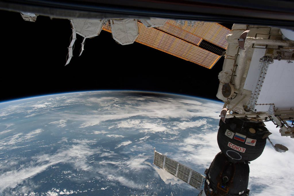 The shadow of the Moon passes above Earth during the total eclipse on August 21, 2017. This is a view from the International Space Station. Image Credit NASA.