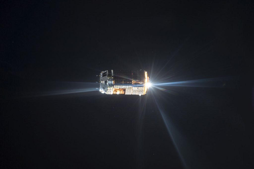 Distant view of Japan Aerospace Exploration Agency (JAXA) Kounotori 5 H-II Transfer Vehicle (HTV-5) during its final approach for docking with the International Space Station (ISS) with darkness of space in the background. Image Credit: NASA.