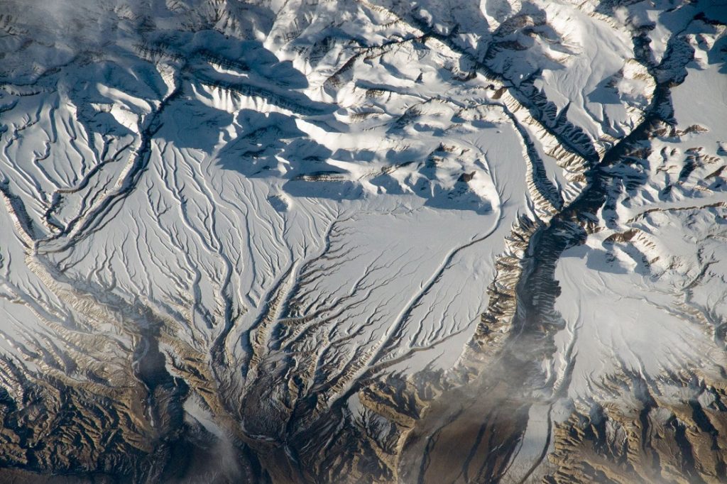 The Himalaya range, near the China–India border where peaks cast strong evening shadows on the snow. Image Credit: NASA.