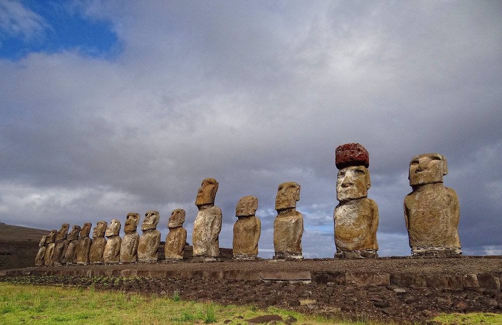 Ahu Tongariki. The second moai from the right has a pukao on its head. Image Credit: Wikimedia Commons.