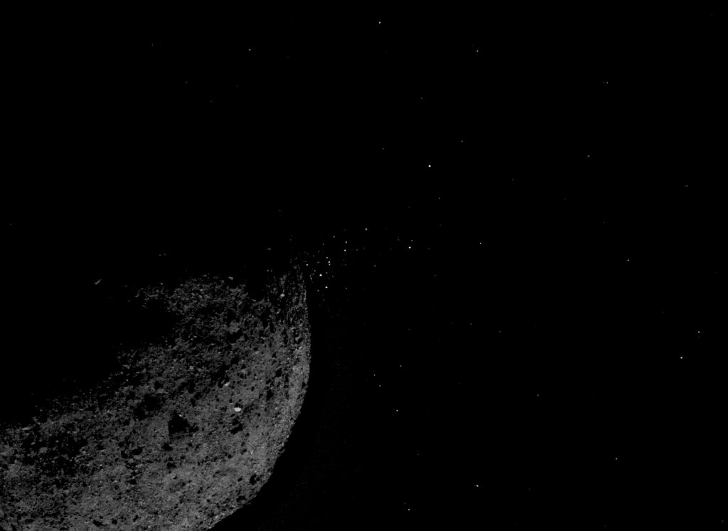 This view of asteroid Bennu ejecting particles from its surface on January 19 was created by combining two images taken by the NavCam 1 imager onboard NASA’s OSIRIS-REx spacecraft: a short exposure image (1.4 ms), which shows the asteroid clearly, and a long exposure image (5 sec), which shows the particles clearly. Other image processing techniques were also applied, such as cropping and adjusting the brightness and contrast of each layer. Image Credit: NASA/Goddard/University of Arizona/Lockheed Martin.