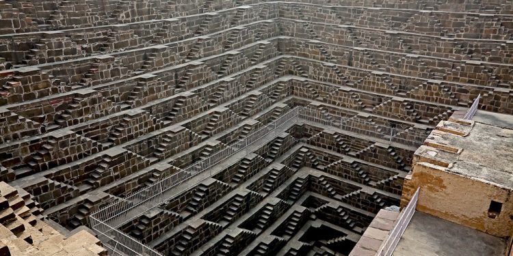 The Ancient Stepwell of Chand Baori—with 3,500 narrow steps over 13 levels high. Image Credit: Pinterest.