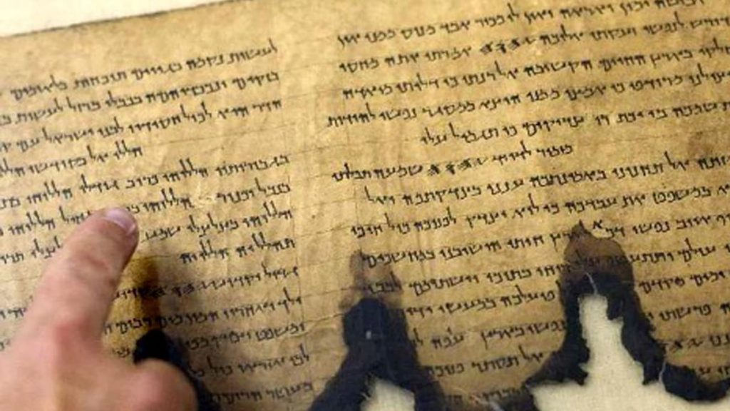 A fragment of the Dead Sea Scrolls at an Israel Antiquities Authority conservation laboratory in Jerusalem. Image Credit: AP.