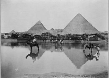 A Village and the pyramids during the flood-time, circa 1890 (Public Domain).