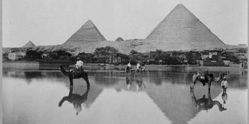 A Village and the pyramids during the flood-time, circa 1890 (Public Domain).
