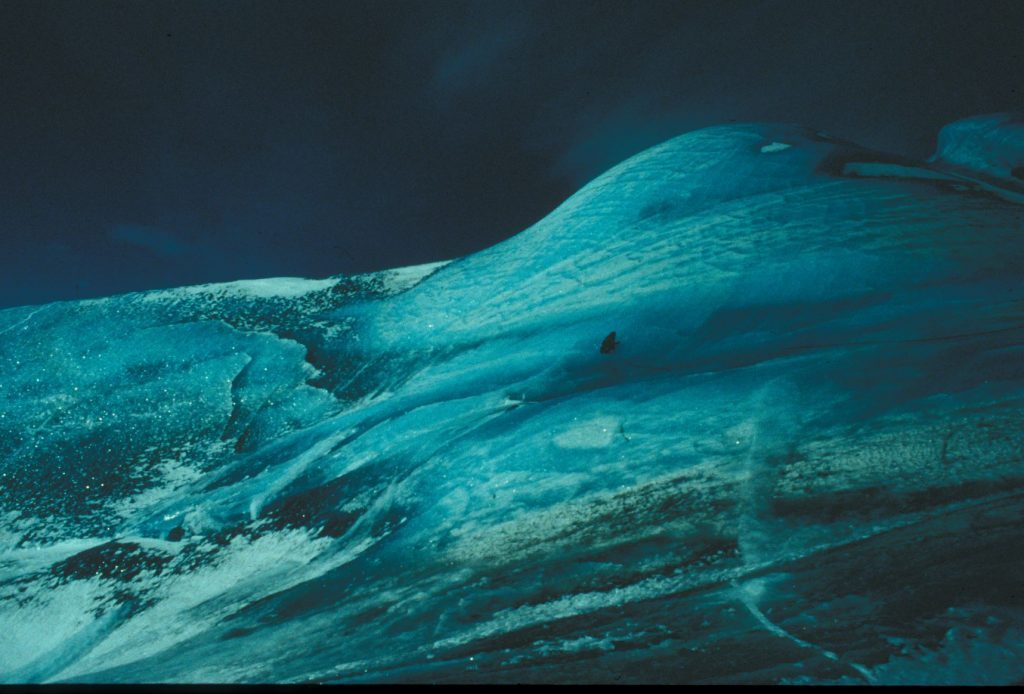 Researchers on top of a large composite iceberg in October 1996. Image Credit: Collin Roesler.