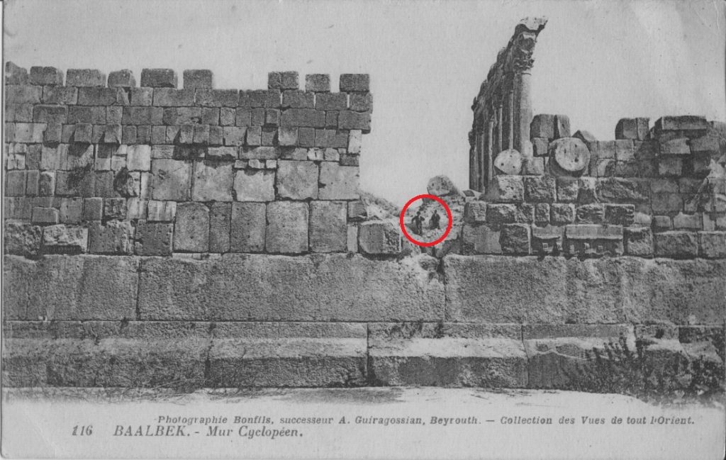A stunning view of the massive, 1,200-ton block of stone at Baalbek, compared to two people sitting above it.