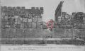 A stunning view of the massive, 1,200-ton block of stone at Baalbek, compared to two people sitting above it.