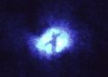 Hubble Finds Mysterious “Cross” At the Center of a Galaxy
