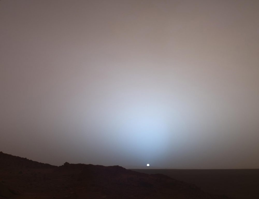 On May 19th, 2005, NASA's Mars Exploration Rover Spirit captured this stunning view as the Sun sank below the rim of Gusev crater on Mars. Image Credit: NASA/JPL/Texas A&M/Cornell.