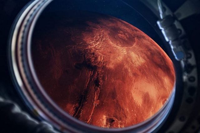An artists illustration of a spacecraft visiting Mars. Shutterstock.