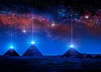 An artists illustration of pyramids with a glowing pyramidion. Shutterstock.