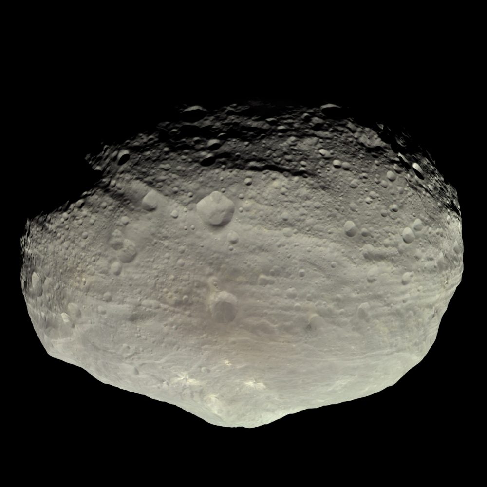 Vesta is a colorful world; craters of a variety of ages make splashes of lighter and darker brown against its surface. Image Credit: Wikimedia Commons / Public Domain.