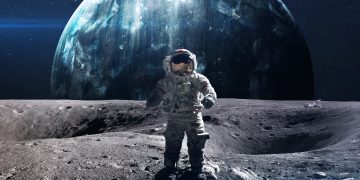 An artistic rendering of an astronaut standing on the Moon. Depositphotos.