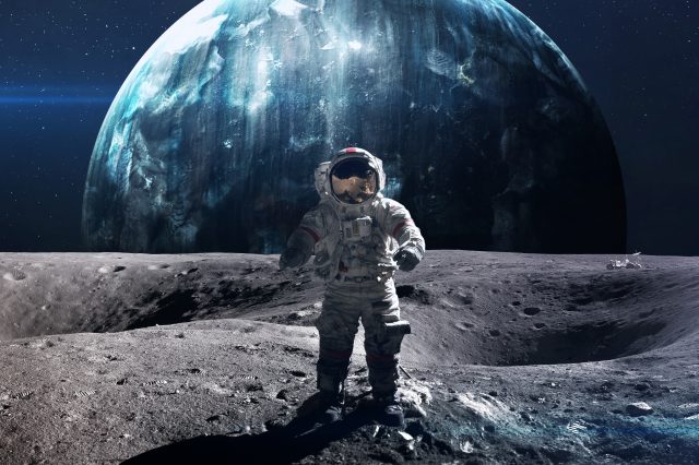 An artistic rendering of an astronaut standing on the Moon. Depositphotos.