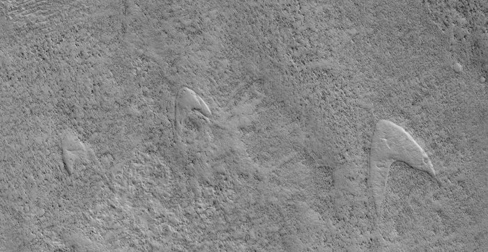 A wide image of the region shows several 'crescent-moon' dunes. Image Credit: NASA/JPL/University of Arizona.