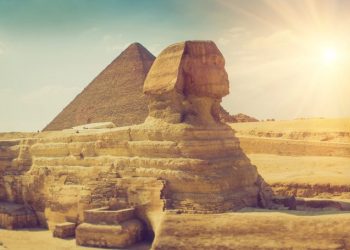 An image of the Sphinx with the pyramid in the background.