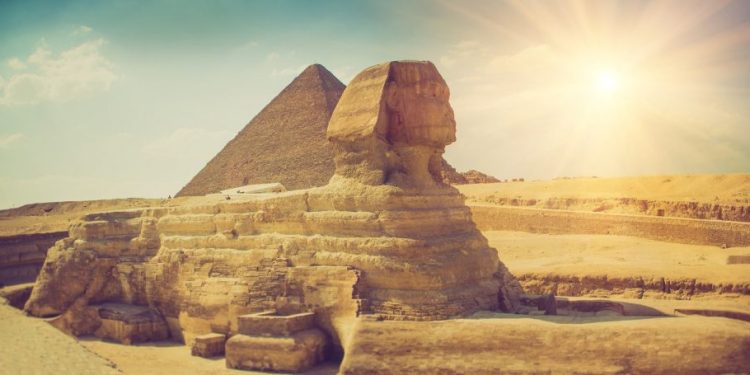 An image of the Sphinx with the pyramid in the background.