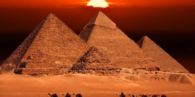 The Pyramids at Giza and the sunset. Shutterstock.