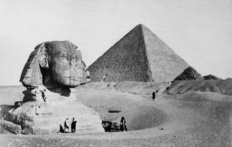 The Great Sphinx with the Pyramid of Pharaoh Cheops in the background. 1877 photo by French photographer Henri Bechard. Shutterstock.