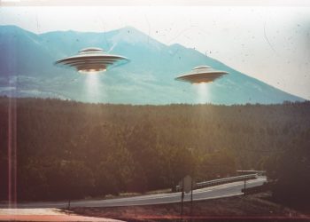 Two UFOs flying in the sky. Shutterstock.