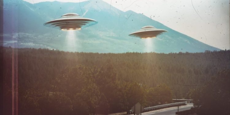 Two UFOs flying in the sky. Shutterstock.