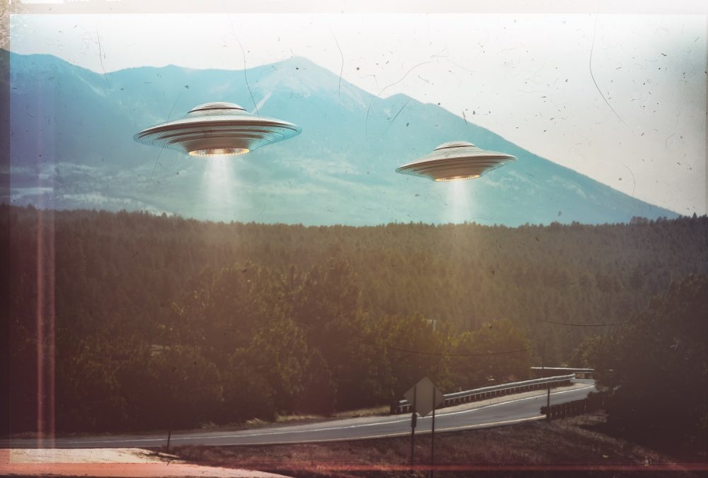 Two UFOs flying in the sky. Shutterstock.