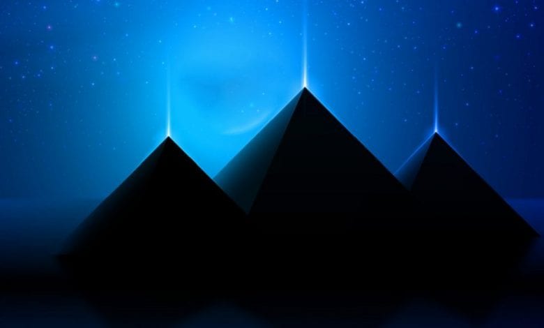 An artists illustration of three pyramids that shine. Shutterstock.