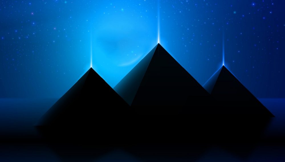 An artists illustration of three pyramids that shine. Shutterstock.