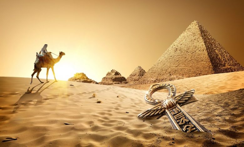 Camel rider, the Pyramids, and an ancient treasure in the sand. Shutterstock.
