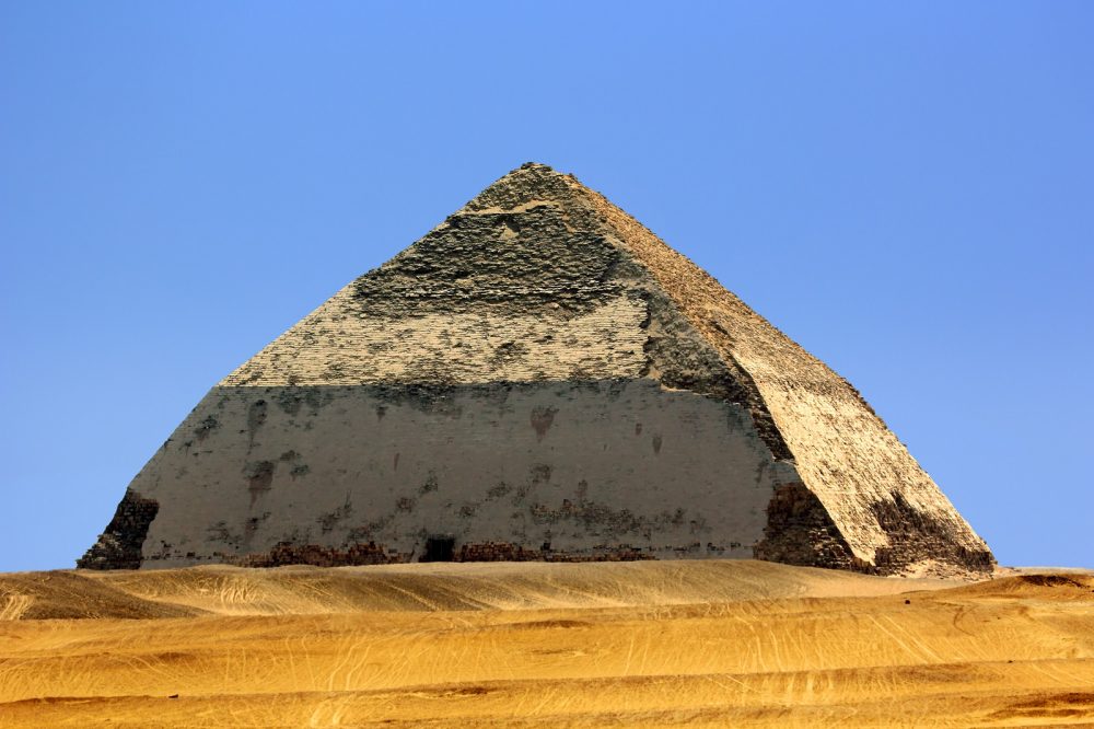 The Bent Pyramid, also knew as the False, or Rhomboidal Pyramid because of it changed angle slope, commissioned by Pharaoh Sneferu. Shutterstock.