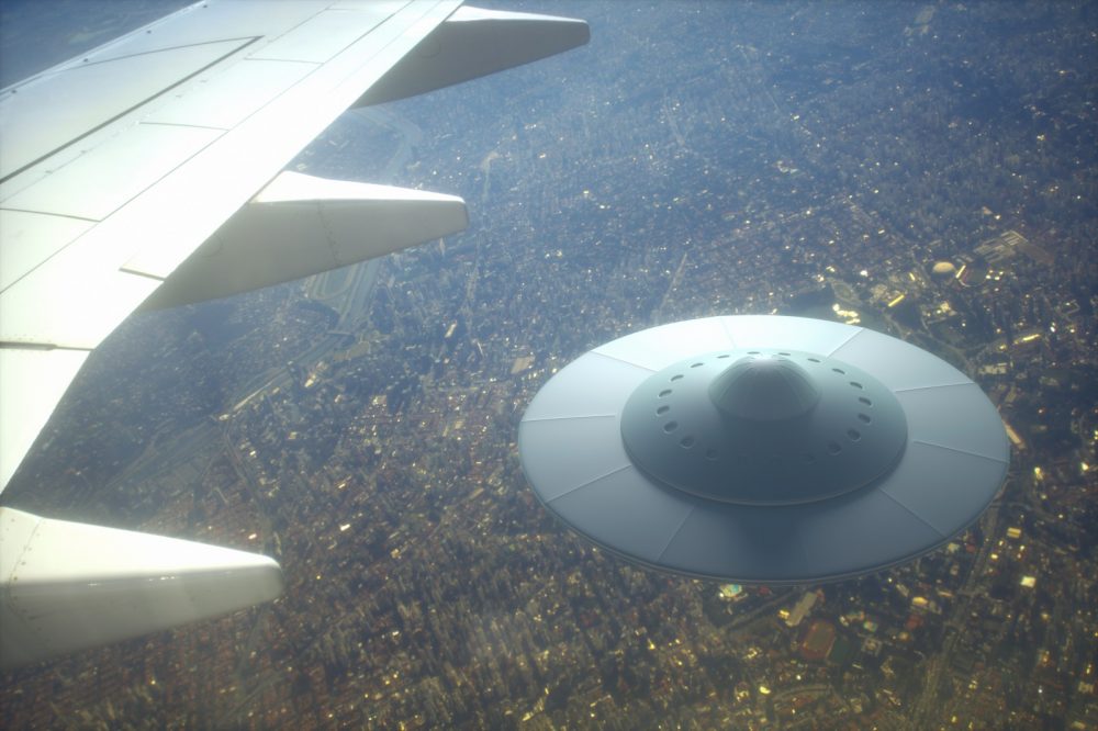 Artists illustration of a UFO following an Airplane. Shutterstock.