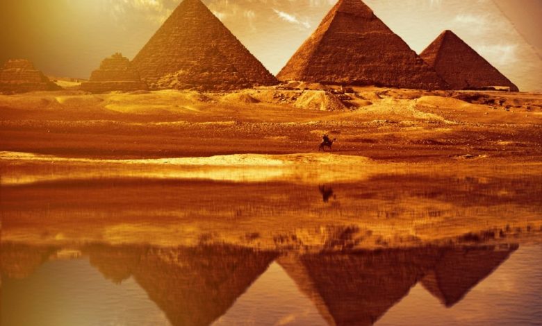 The reflection of the pyramids at Giza, as above so below. Shutterstock.