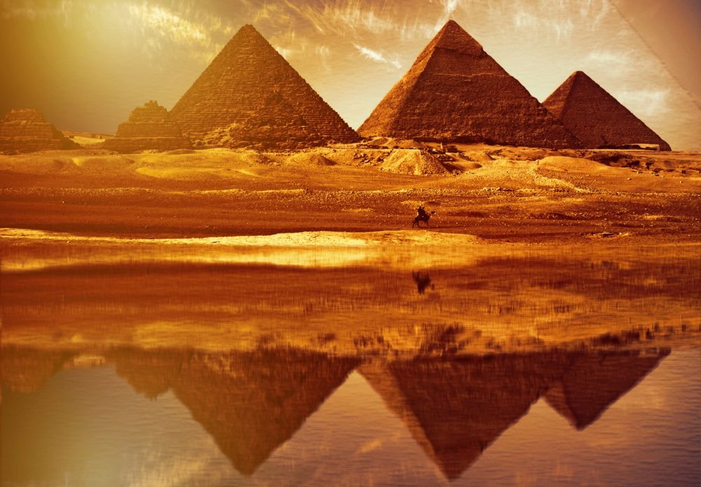 The reflection of the pyramids at Giza, as above so below. Shutterstock.
