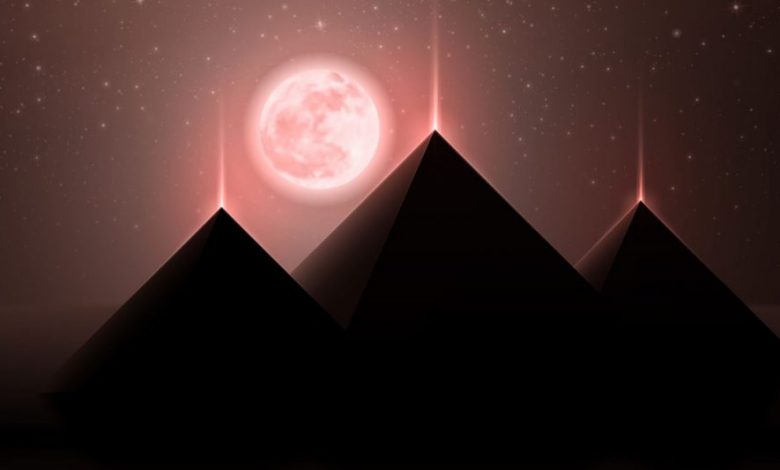 An artists rendering of the three pyramids at Giza and the Moon. Shutterstock.