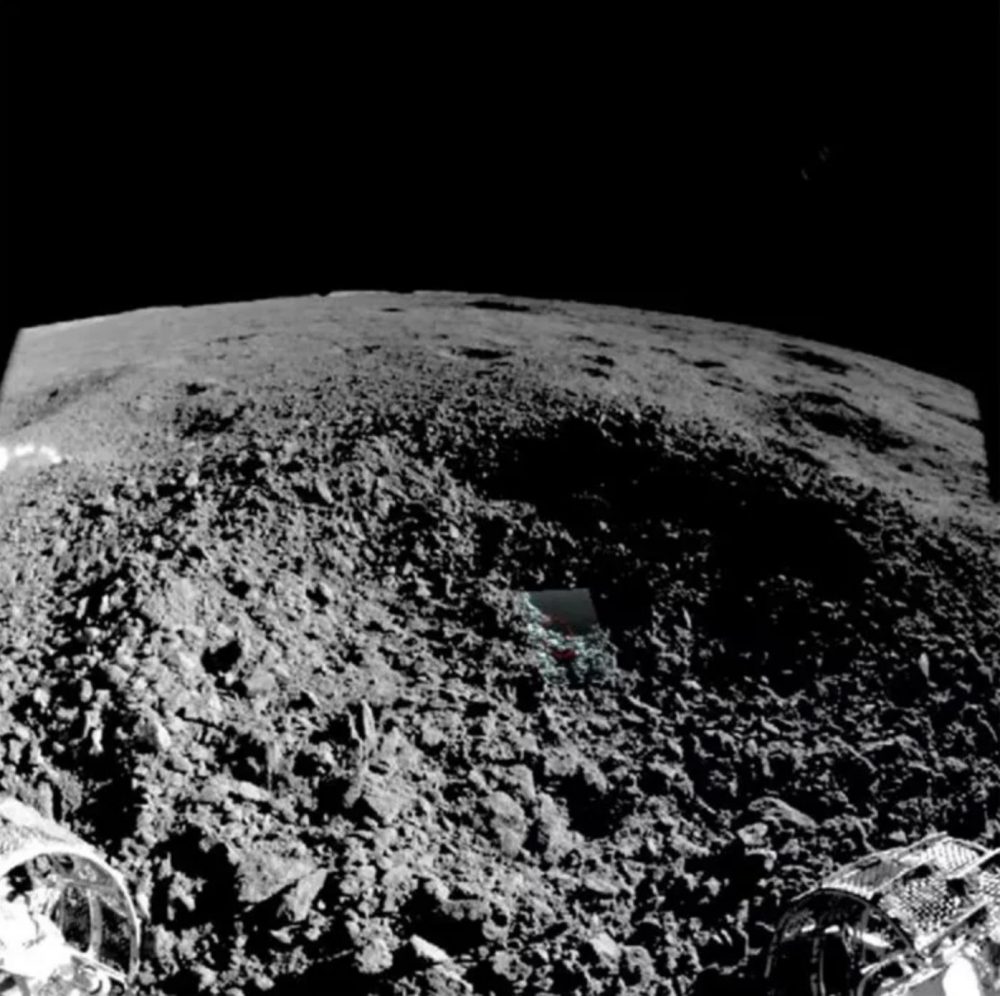 China's Yutu-2 moon rover captured this image from the edge of the small crater where it found a mysterious, gel-like material. Image Credit: China Lunar Exploration Project.