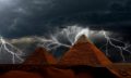 Pyramids and Storm in the background. Shutterstock.