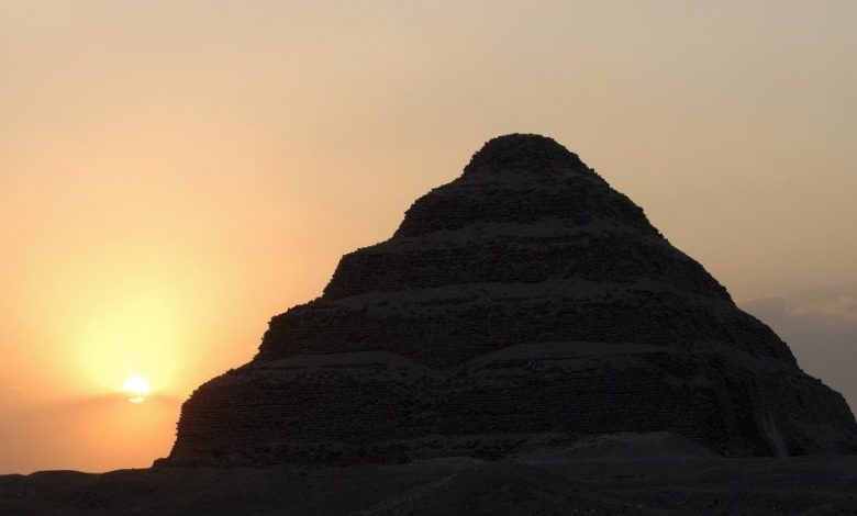 The Step Pyramid of Saqqara and the Sun in the background. Shutterstock.