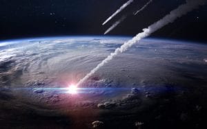An illustration showing asteroids impacting Earth. Shutterstock.