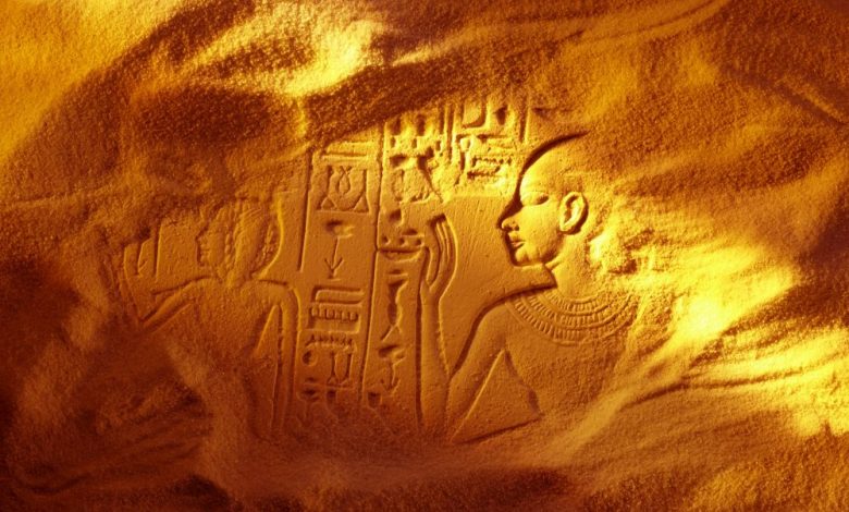 An image of an ancient Egyptian structure buried beneath the sand. Shutterstock.